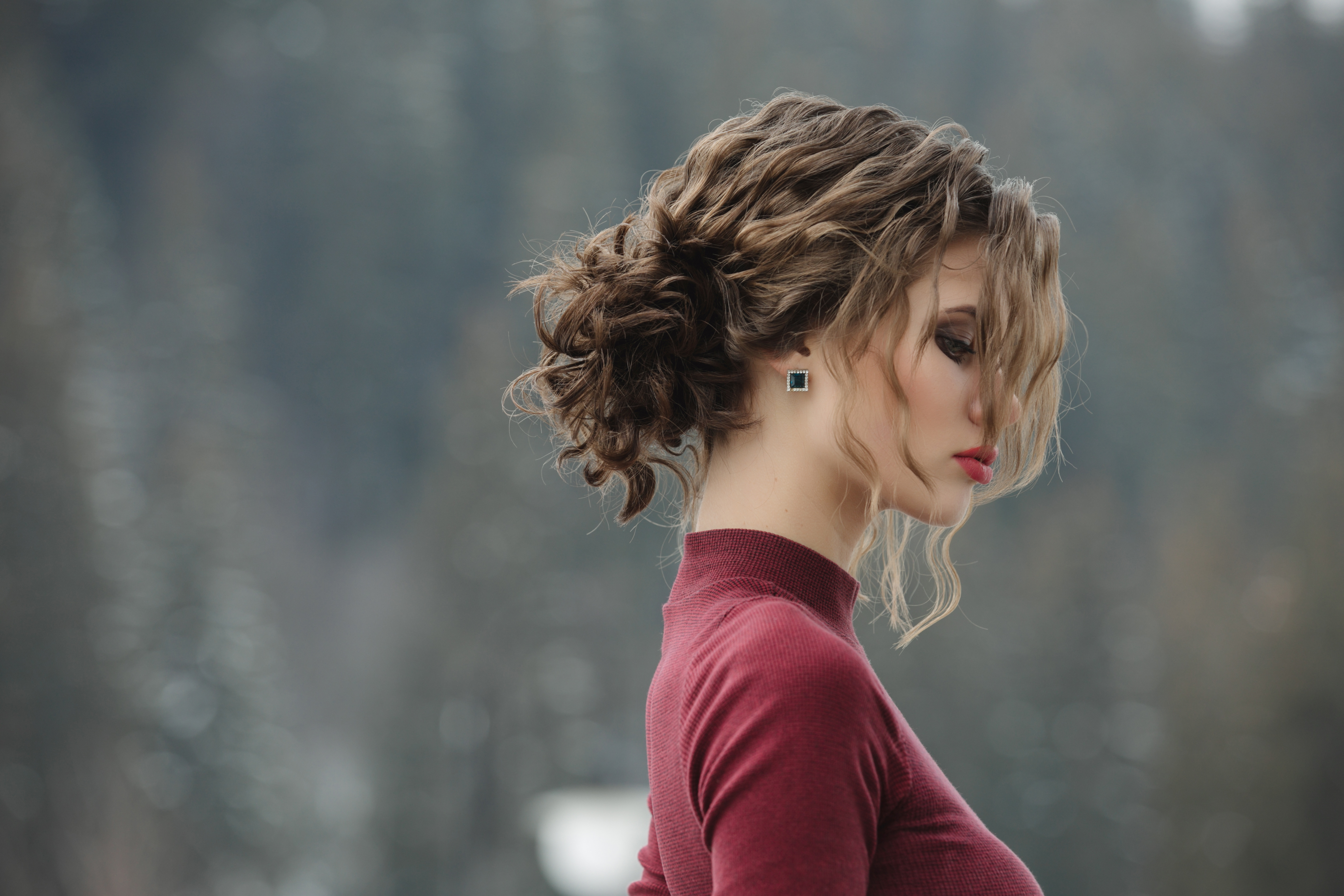 Woman with curly hairstyle at winter